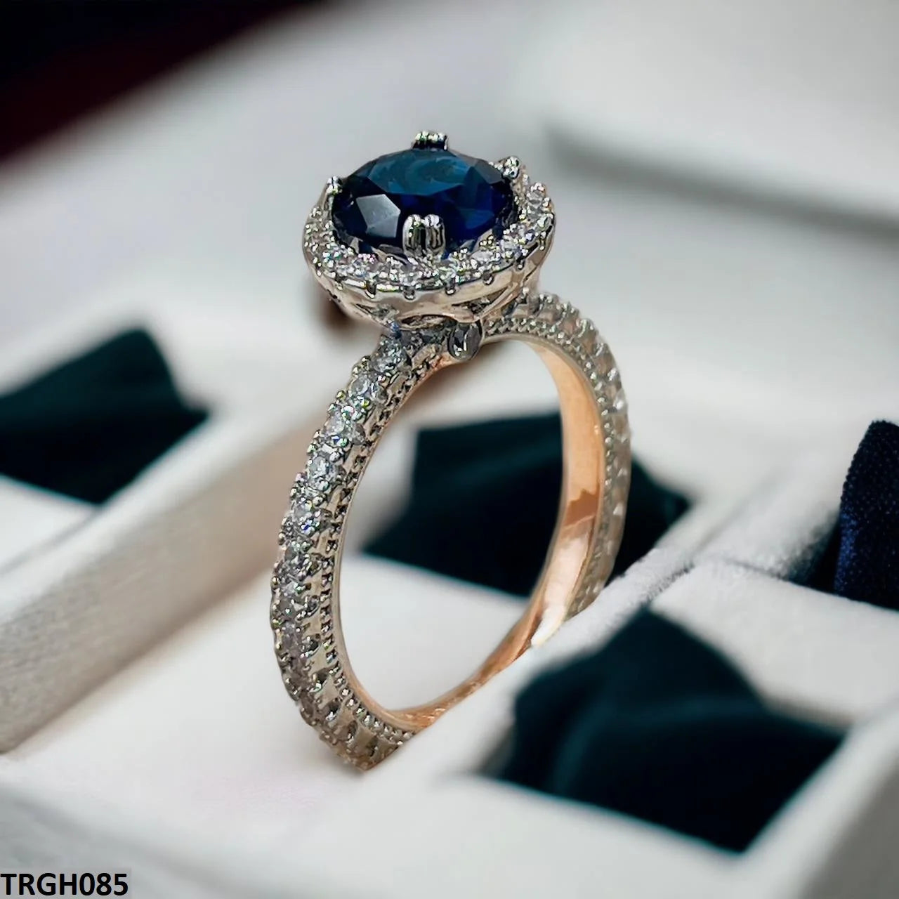 Oval Cut Dark Blue Sapphire Halo Engagement Ring in Rose Gold | Style