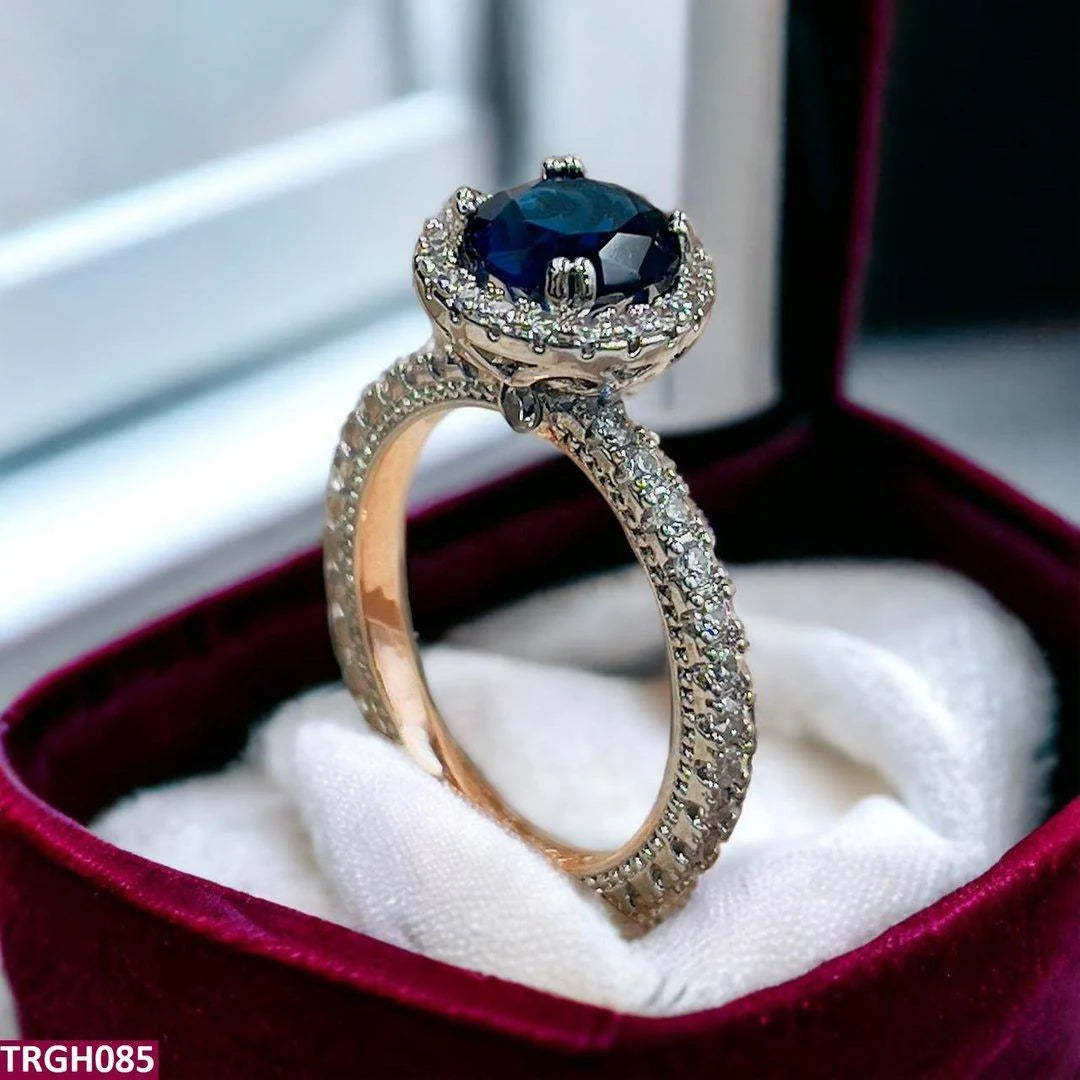Oval Cut Dark Blue Sapphire Halo Engagement Ring in Rose Gold | Style