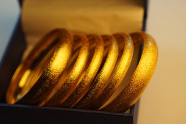 textured-gold-bangles-closeup textured-gold-bangles-closeup